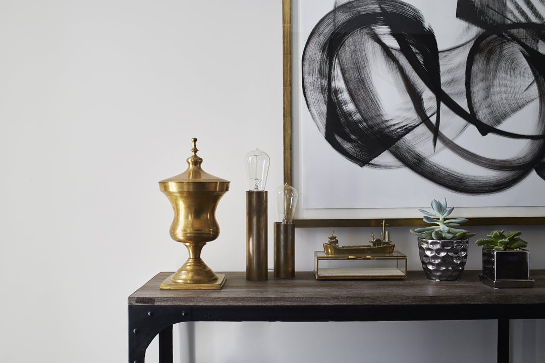 Console table with Modern art and interesting decor
