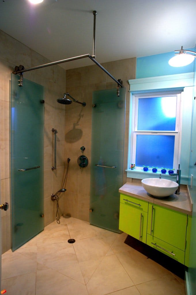 Curbless Double bi-fold shower doors. Satin Glass