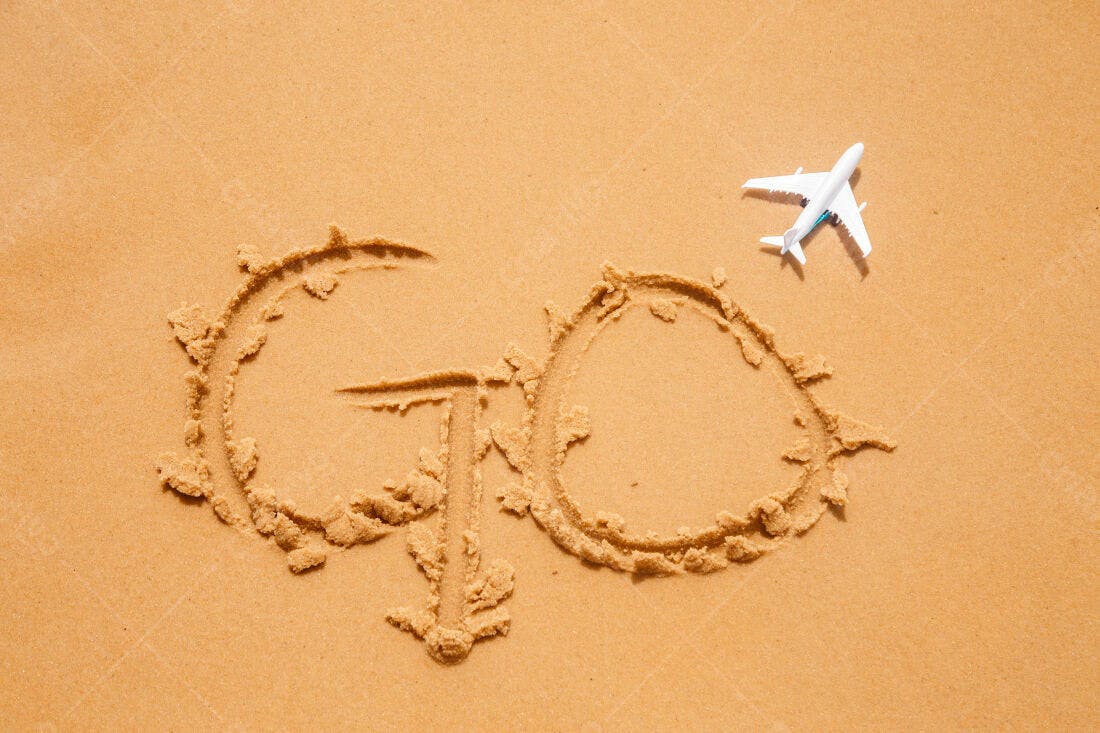 Areia praia escrita GO avião