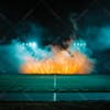 Modernized football stadium filled with smoke and illuminated by lights.