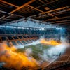 Modernized soccer stadium filled with smoke, illuminated by lights