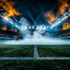 Modernized football stadium, smoke filled, illuminated by lights