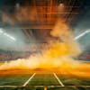 Modernized soccer stadium filled with smoke and lit up by lights