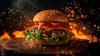 Complete burger, on top of a board with sparks background