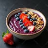 Acai bowl with strawberries and granola.