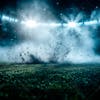 Soccer field at night with fog and dust