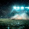 Soccer field at night with fog and dust