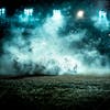 Soccer field at night with fog and dust