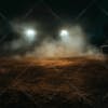 Image of an improvised soccer field at night with lights