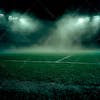 Soccer field filled with fog and dust particles