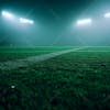 Soccer field full of fog and dust particles