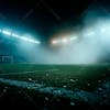 Soccer field full of fog and dust particles