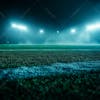 Soccer field filled with fog and dust particles.