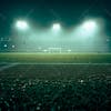 Soccer field filled with fog and dust particles.