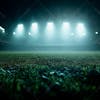 Football field filled with fog and dust particles