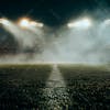 Football field filled with fog and dust particles