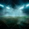 Soccer field filled with fog and dust particles.