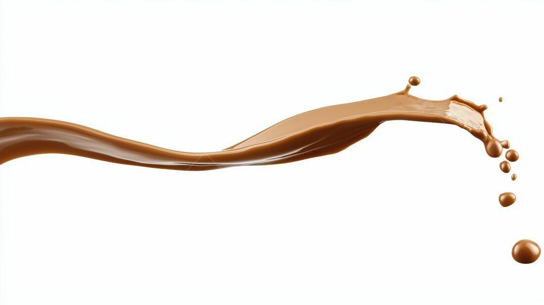 Salpico de chocolate líquido em fundo branco