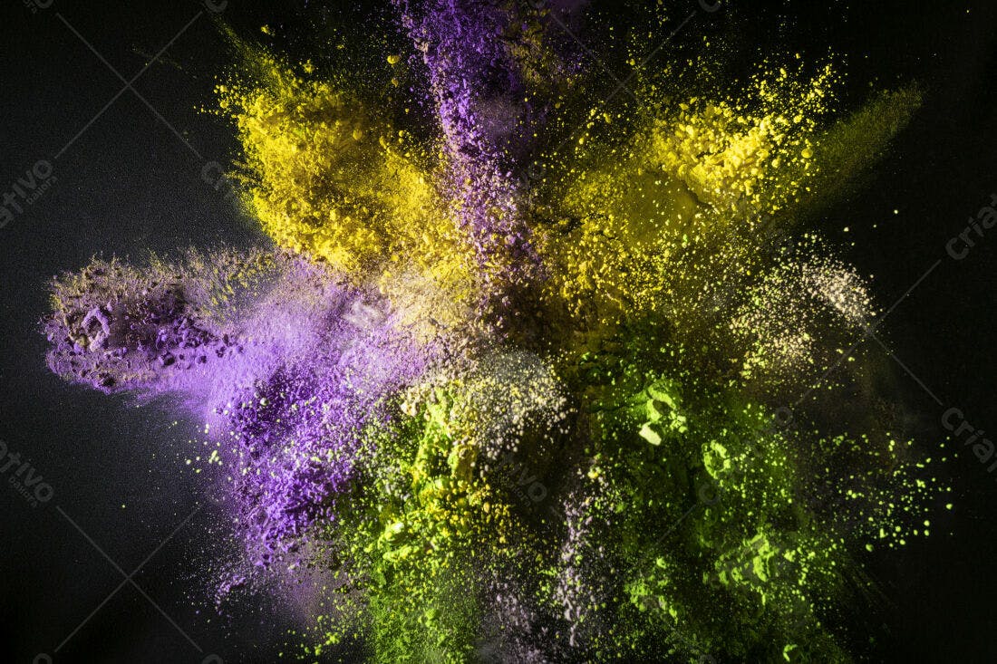 Explosão de pó colorido amarelo roxo e verde