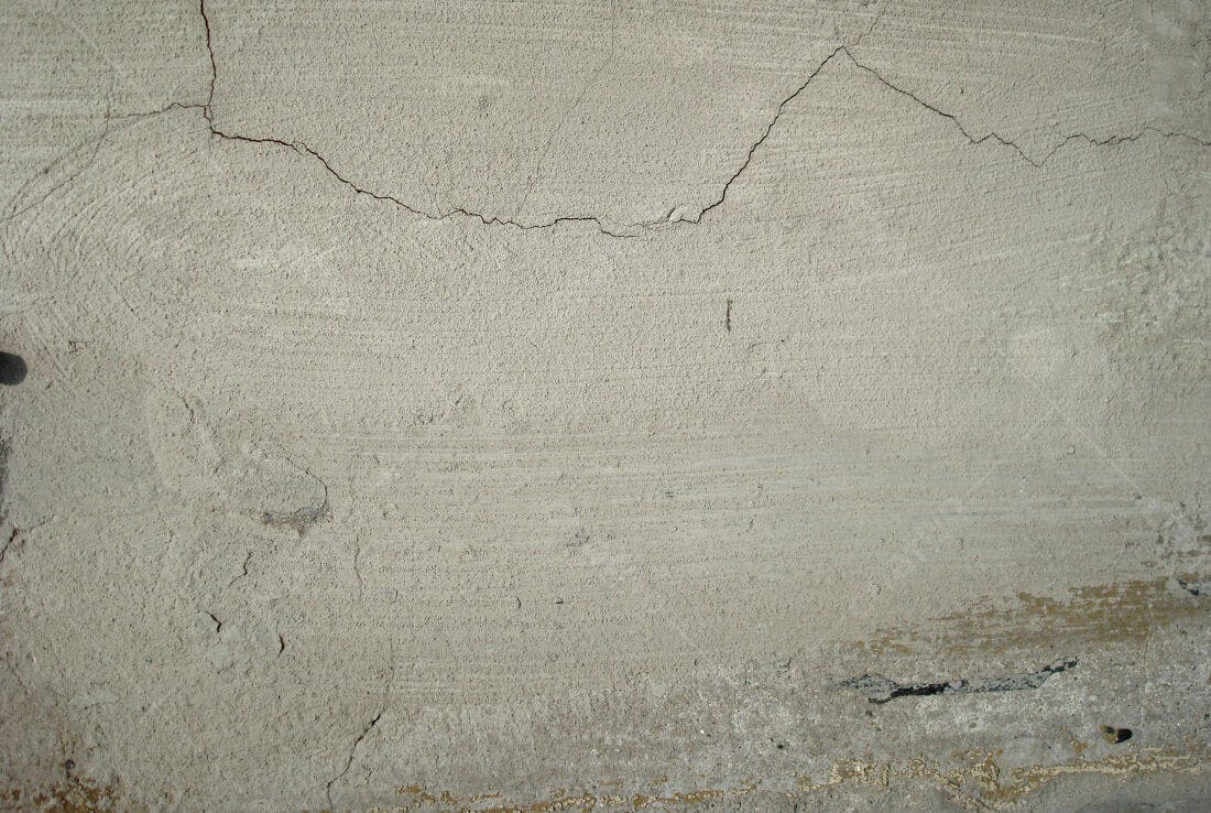 Textura de concreto rachado bege claro
