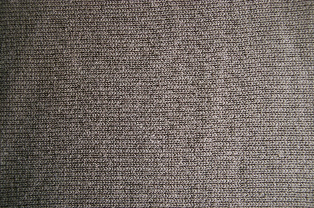 Textura de tecido marrom claro em malha
