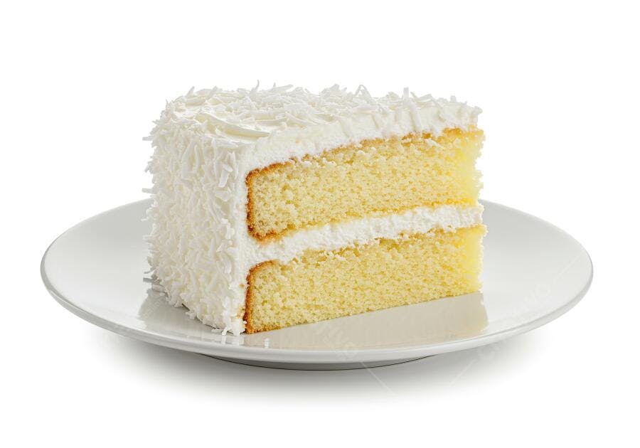 Bolo de coco e baunilha em prato branco
