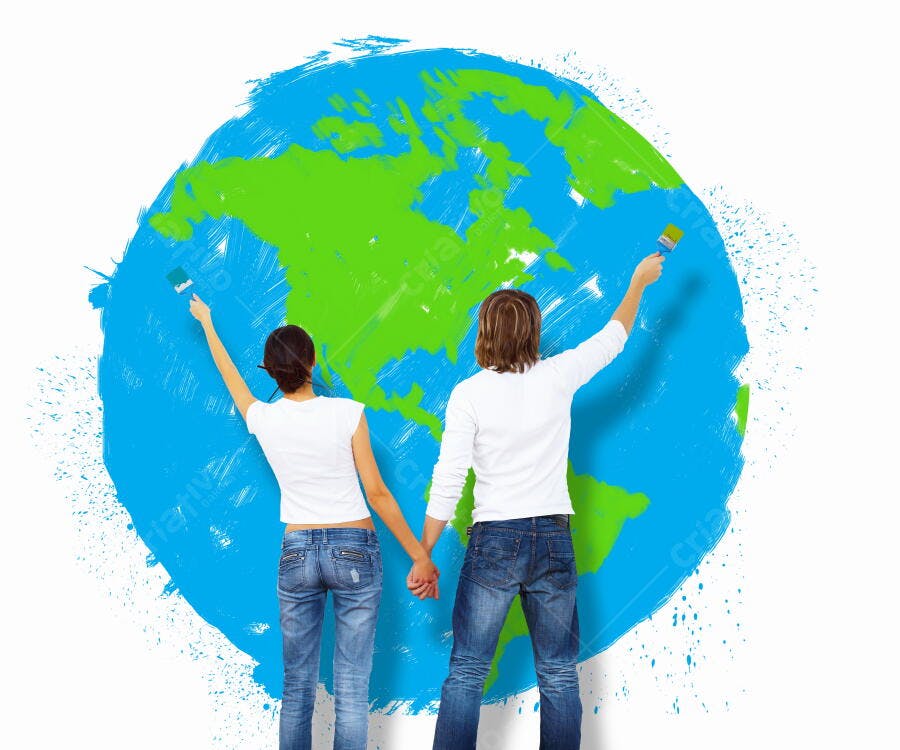Casal pintando globo terrestre azul e verde