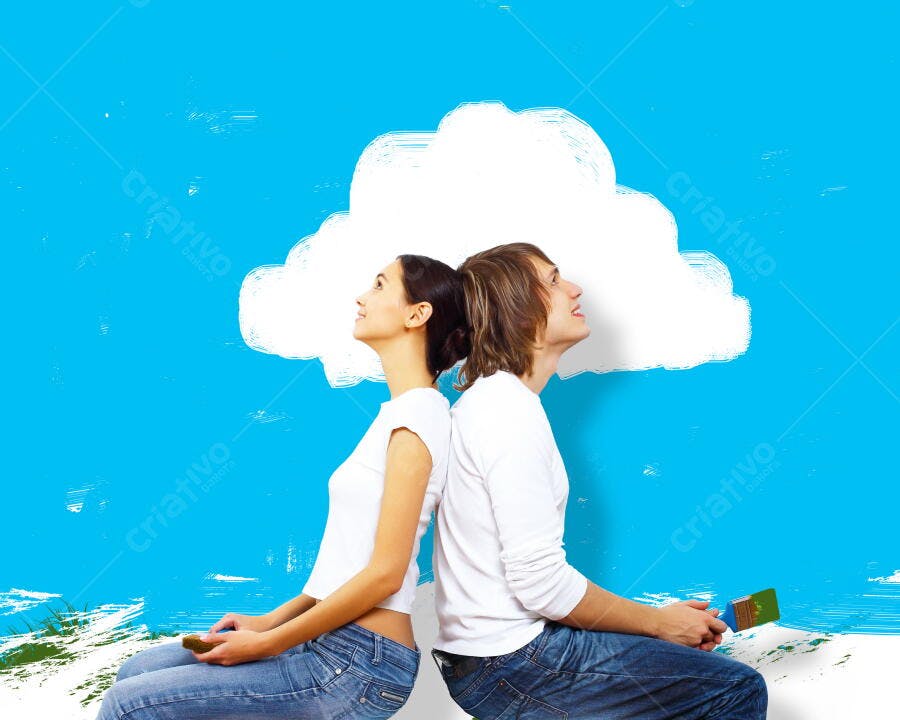 Casal jovem pintando parede azul com nuvem
