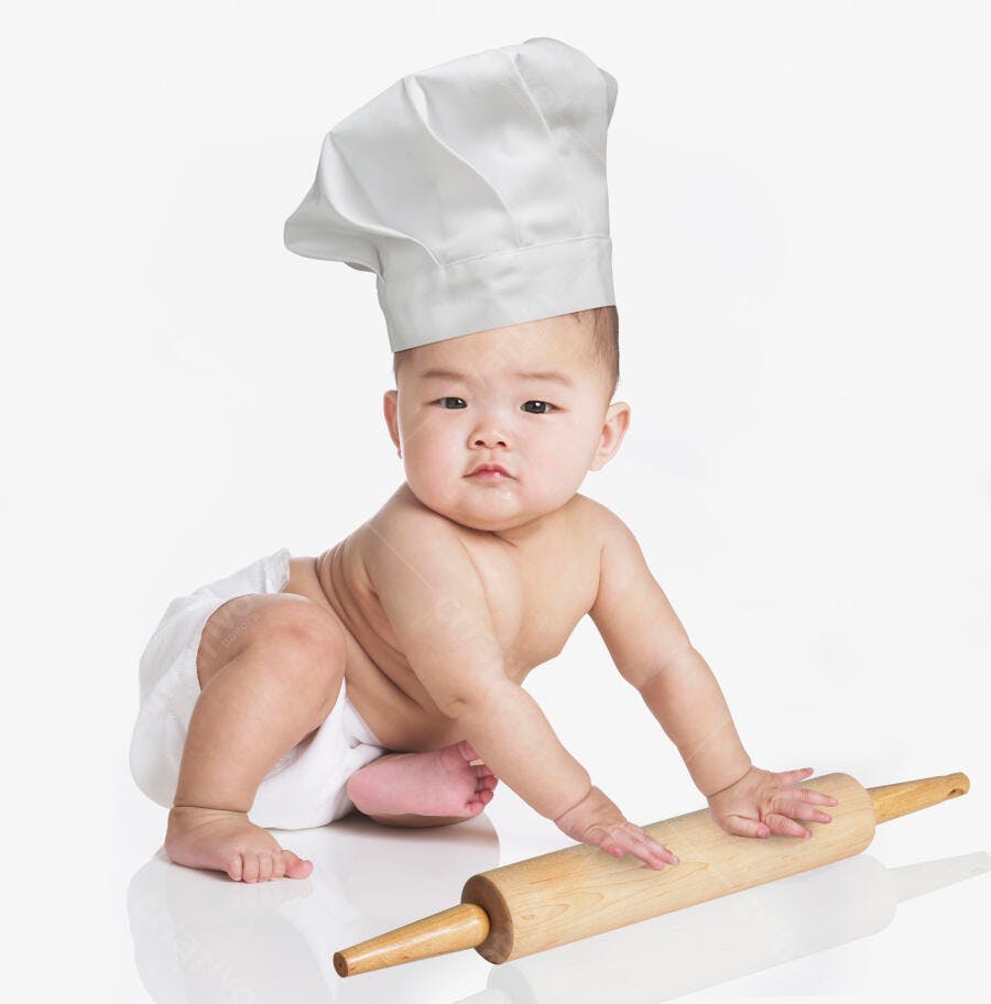 Bebê chef com rolo de massa