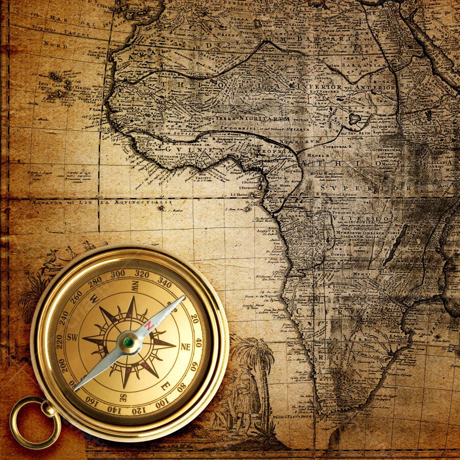 Bússola antiga sobre mapa vintage