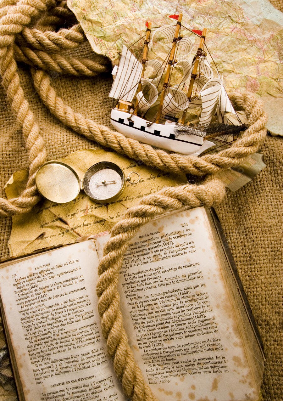 Navio antigo com bússola e corda