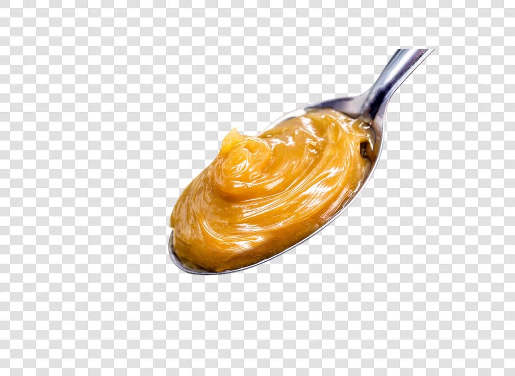 Colher com Doce de Leite Cremoso em Caramelo PNG com fundo transparente