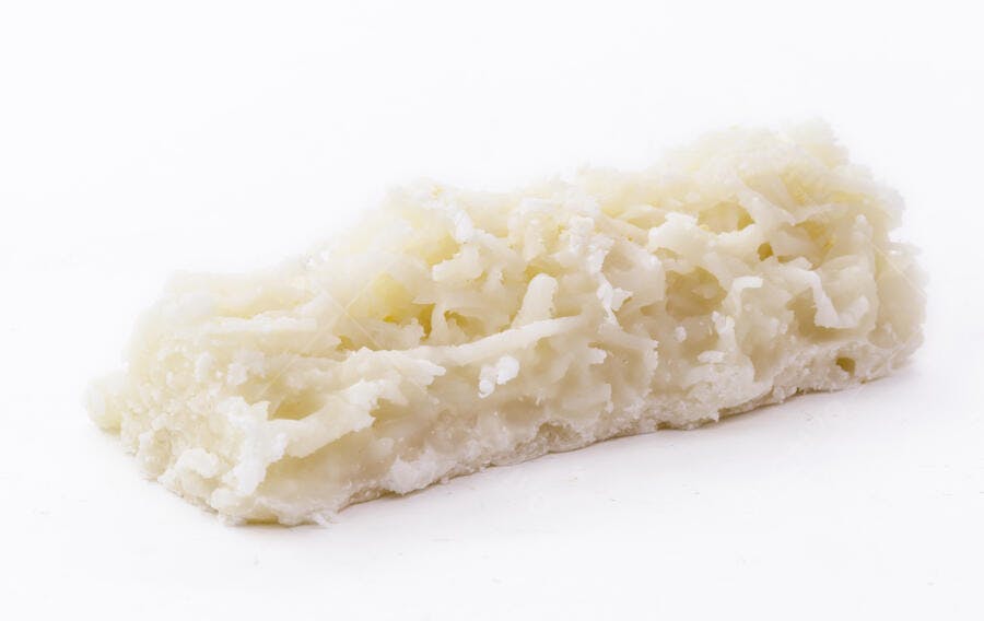 Barra de coco ralado doce branca em estúdio