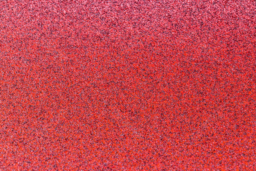Textura granulada vermelha e laranja degradê abstrato