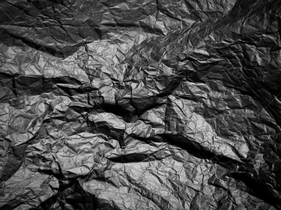 Textura papel amassado escuro para fundo grunge abstrato
