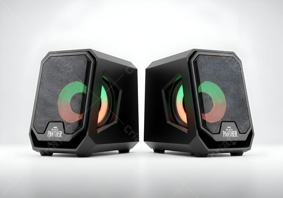 Caixas de som gamer pretas com iluminação RGB em estúdio branco