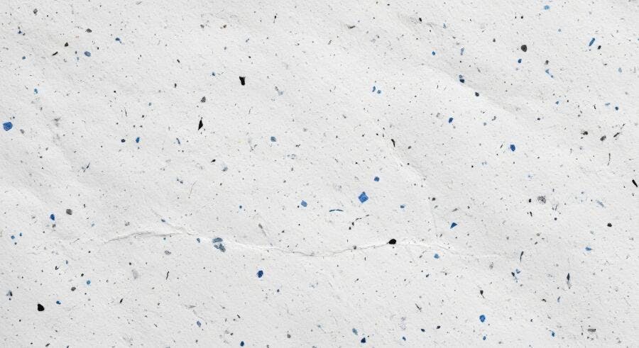 Textura papel reciclado branco com pontos coloridos para fundo