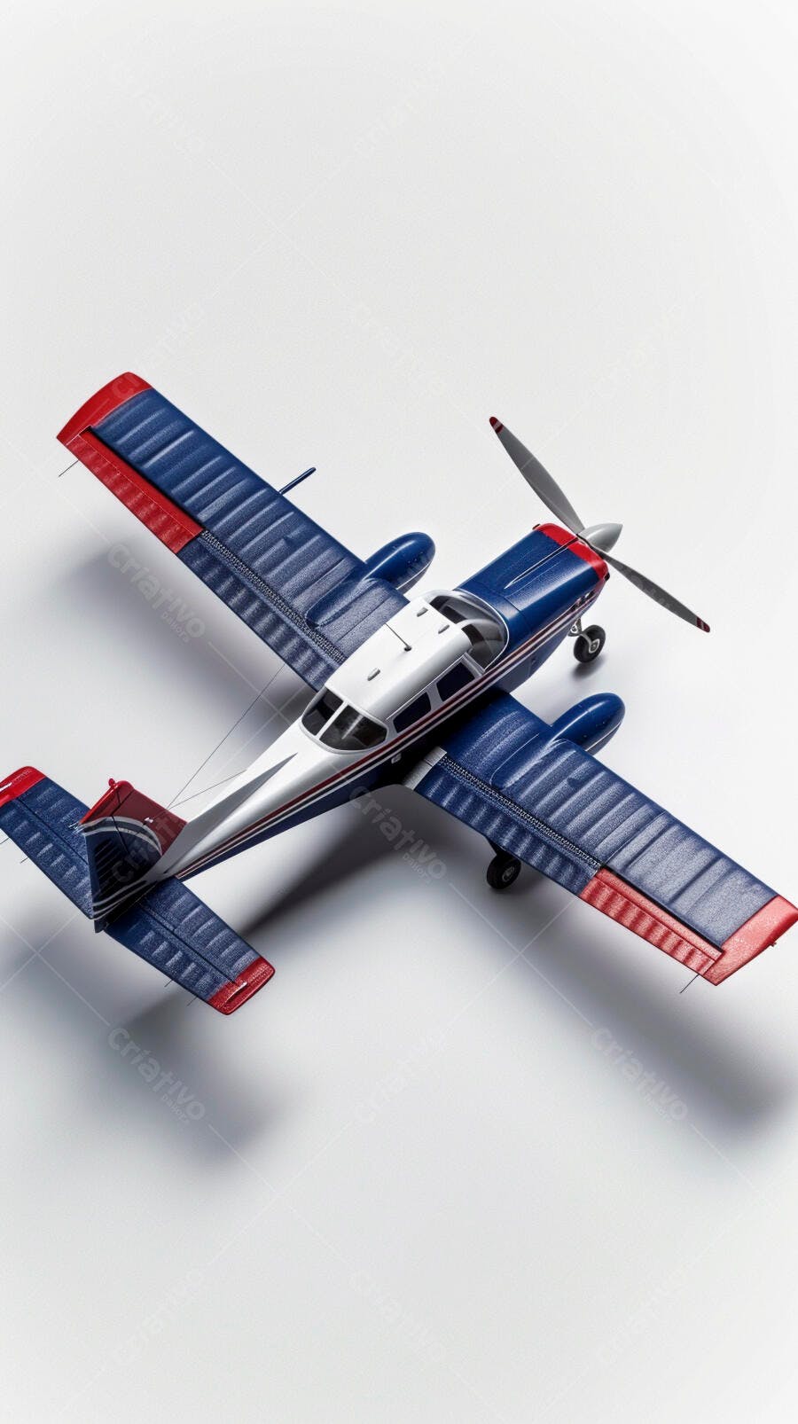 Avião modelo azul branco e vermelho com hélice em estúdio fundo branco