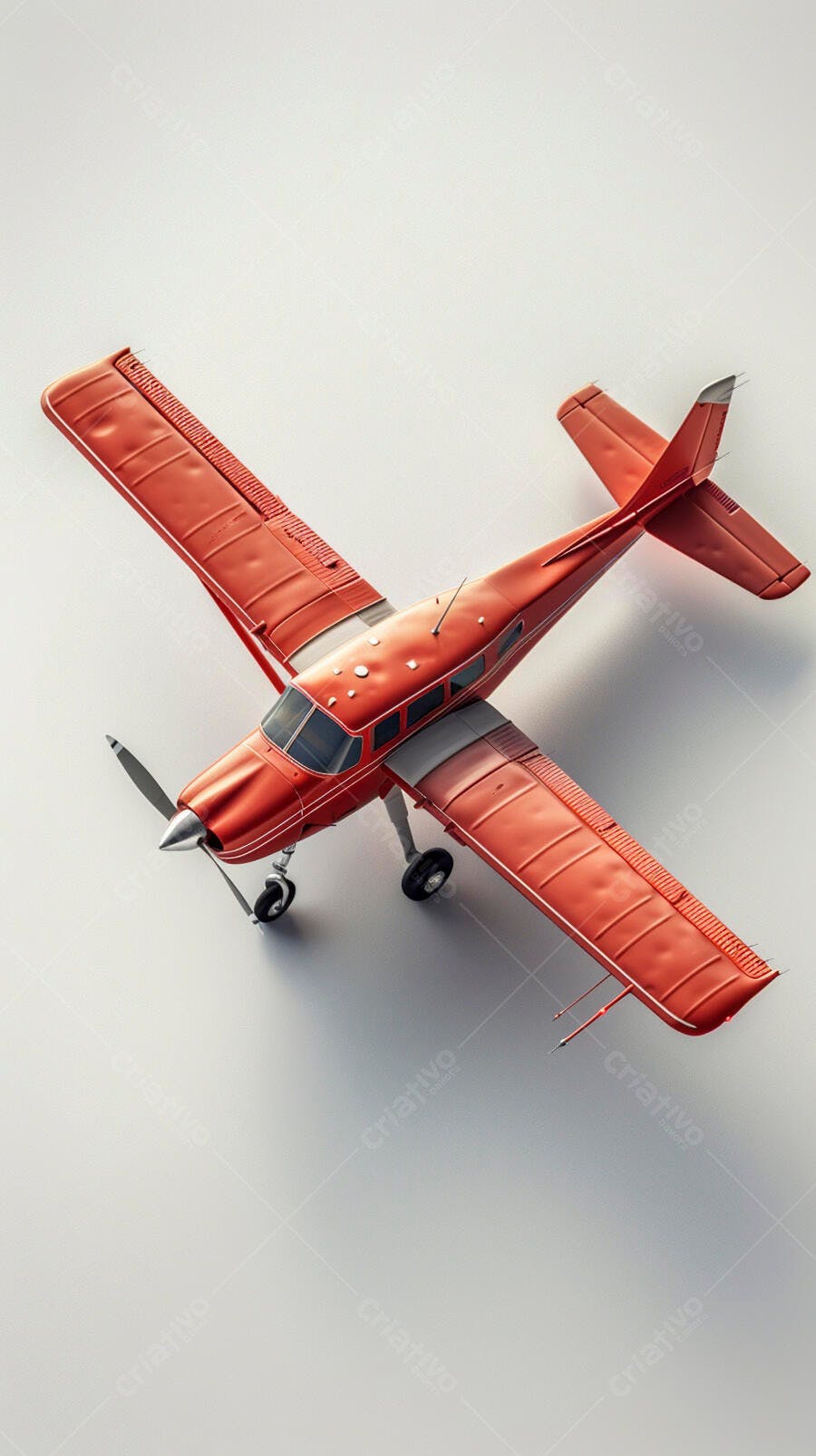 Avião vermelho monomotor de hélice em estúdio com fundo branco vista aérea