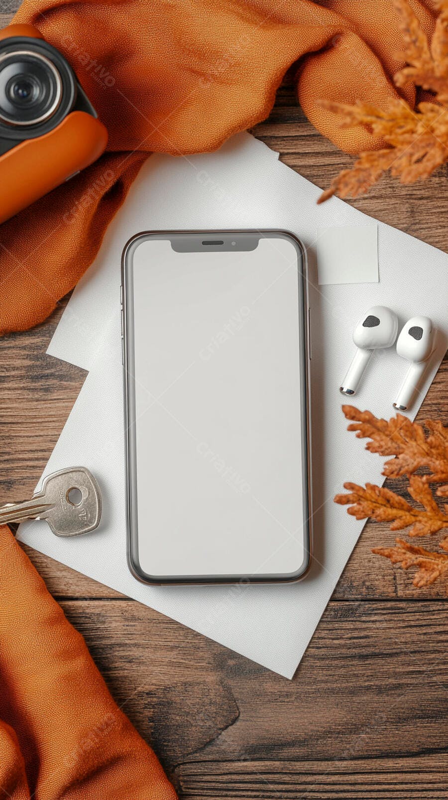 Smartphone mockup fone sem fio e câmera em mesa de madeira outonal