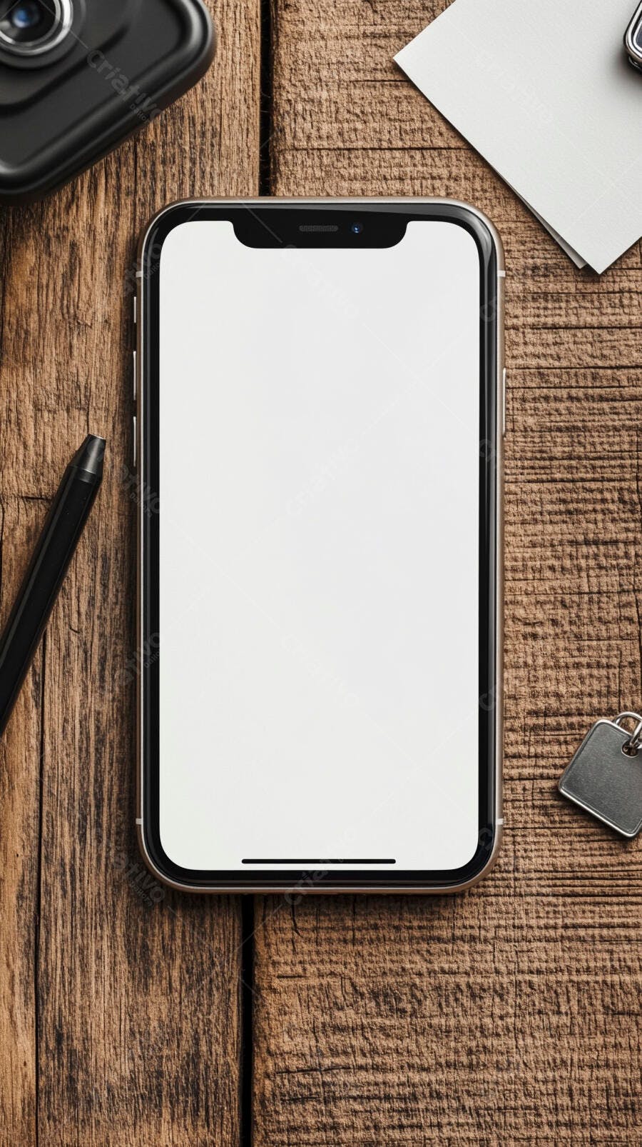 Smartphone iPhone tela branca caneta e itens de escritório em mesa de madeira