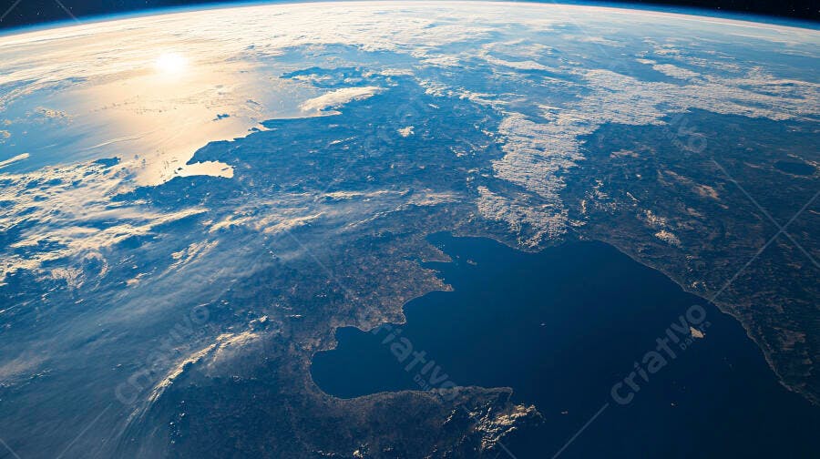 Planeta Terra visto do espaço com luz dourada do sol ao amanhecer